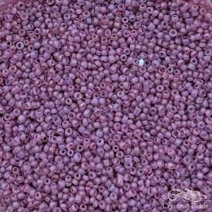 Vintage size 12/0 French glass seed beads in dark mauve pink opal. 10 grams of colorfast handmade antique beads for beadwork restoration.