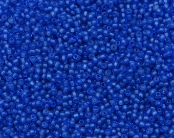 Hand made size 14/0 vintage Venetian glass micro seed beads in transparent sapphire blue. Tiny antique microbeads for dollhouse miniatures