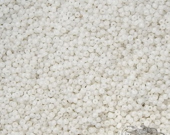 Size 16/0 or 18/0 antique micro seed beads in translucent greasy white. Super tiny vintage glass microbeads in milky white.