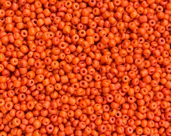 Size 11/0 vintage Venetian seed beads in opaque orange salmon. 10 grams of antique Italian glass rocailles for jewelry making and beadwork.