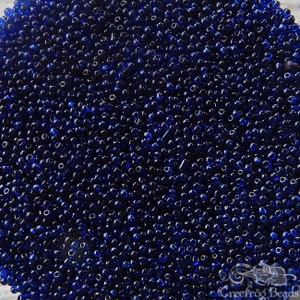 Size 14/0 antique Italian glass seed beads in transparent dark cobalt blue. 5 grams small size 13 or 14 vintage beads in deep indigo blue.