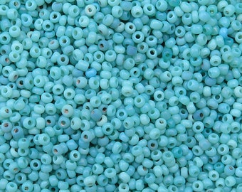 Size 11/0 antique Italian seed beads in opaque baby blue and turquoise mix. 10 grams of vintage Venetian glass beads in shades of pale blue.