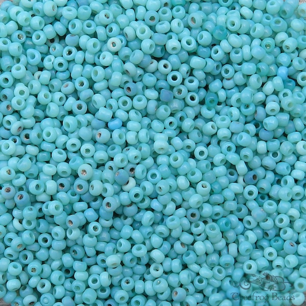 Size 11/0 antique Italian seed beads in opaque baby blue and turquoise mix. 10 grams of vintage Venetian glass beads in shades of pale blue.