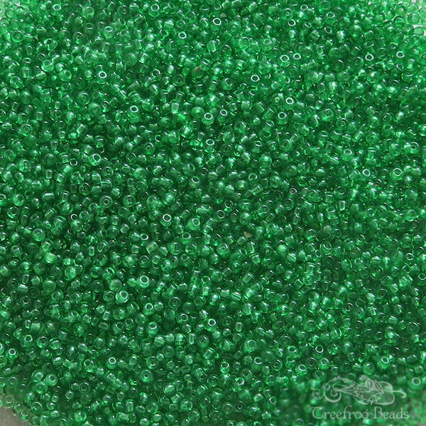 Size 16/0 vintage micro seed beads in transparent green clover. Tiny rare antique glass beads, for purses, doll making and miniatures.
