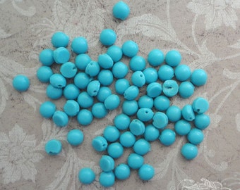 5mm round vintage glass nailhead beads in opaque robin's egg blue. Lot of 24 antique sew ons with flat backs and smooth tops.