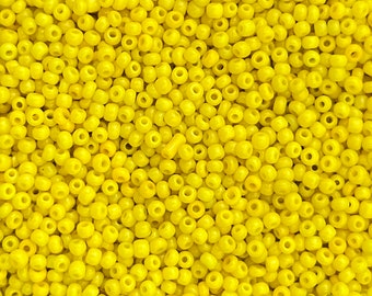 Size 11/0 vintage French seed beads in opaque medium yellow. 10 grams of collectible colorfast glass rocailles for beautiful beadwork.