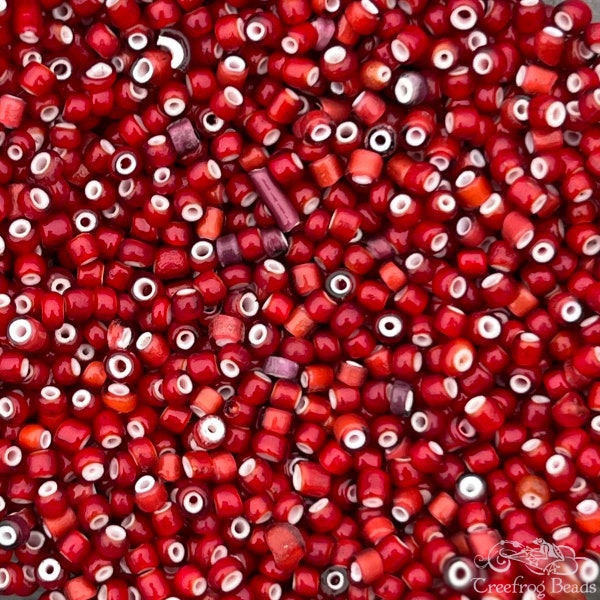 10 grams of vintage Italian white heart seed beads in size 8/0 rose red mix. Antique Venetian glass Hudson Bay or Cornaline D'Allepo beads.