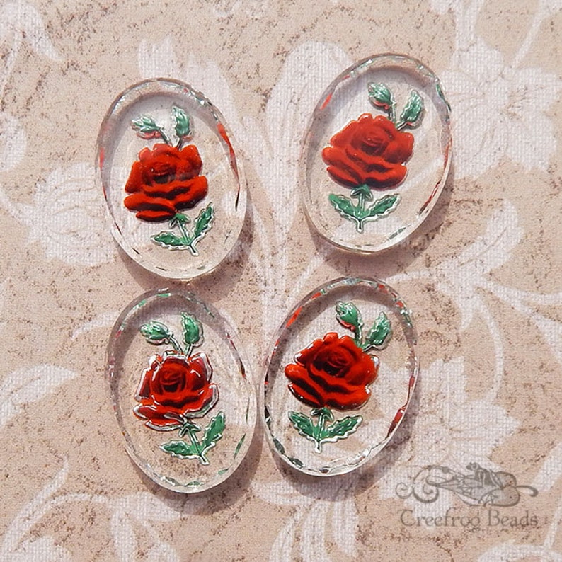 4 red rose glass intaglio stones with crystal clear base. 18x25 mm cabochon w/reverse painted burgundy & red flower. 1960's German cabs. image 1