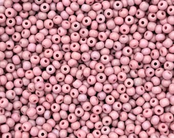 Old Czech glass seed beads, size 8/0 medium pink mix. 1990's vintage rocailles in opaque mauve & rose hues - sold by the ounce or hank.