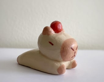 Adorable Capybara Figurine: Tiny Desk Buddy for Animal Enthusiasts