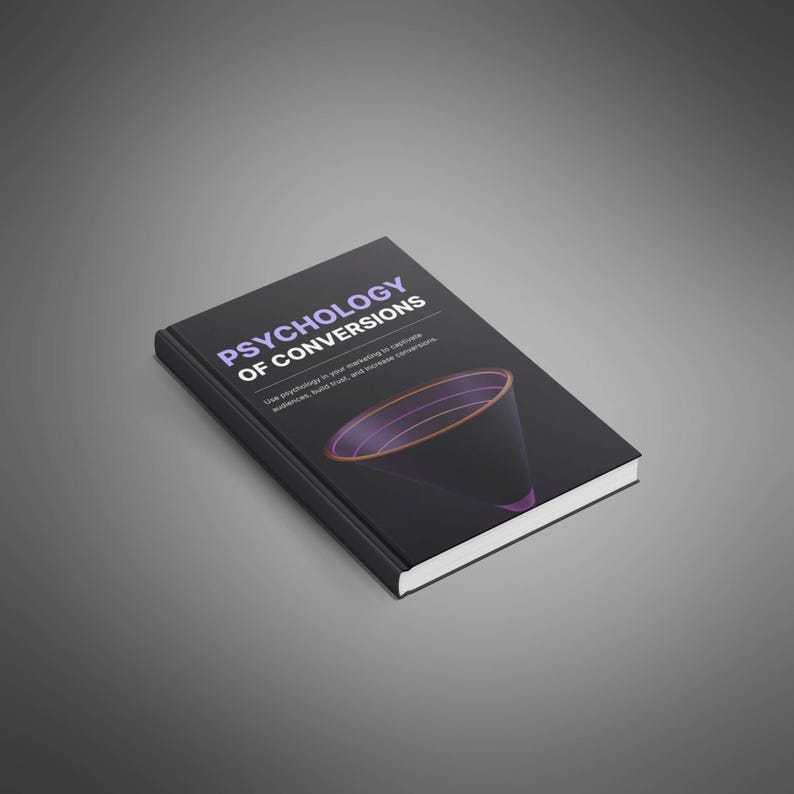 May include: A black hardcover book titled Psychology of Conversions with white and purple text. The cover features a graphic of a dark funnel with purple and orange circular outlines. The book is positioned at an angle on a gray surface.