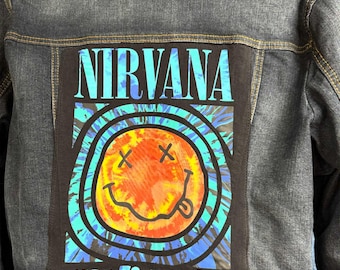Ladies' Nirvana denim jacket. Ladies upcycled Mossimo Brand denim jacket, size XXL with Nirvana tee attached to the back. One of a kind