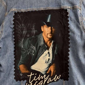 Ladies&#39; Tim McGraw denim jacket, Old Navy Brand Size XL. Ladies&#39; denim jacket, Old Navy Brand, size XL, with attached Tim McGraw tee. 1 only
