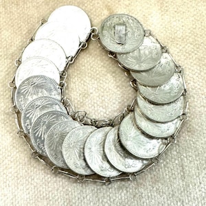 Vintage Mexican silver coin bracelet 19 A 30 N. 1942 for large coin bracelet. I could not find anything about the small coin bracelet.