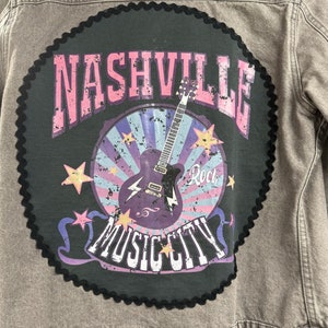 Ladies NEW gray denim jacket, with pink buttons and rhinestones, attached Nashville Music City tee on back. Christine Alexander, S-M size