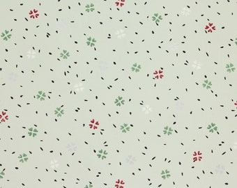 Papel pintado vintage de los años 40: confeti floral verde y rojo sobre fondo verde. Se vende cortado a medida.