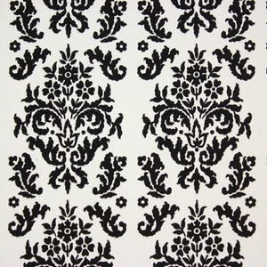 May include: Black and white damask pattern wallpaper with a repeating floral design.