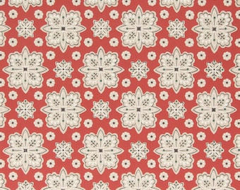 May include: Red background with a repeating pattern of white and green floral designs. The pattern is symmetrical and features a central flower with four petals and four smaller flowers in the corners.