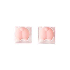 May include: Two pink bunny butt keycaps with a white outline. The keycaps are square and have a raised, rounded shape.