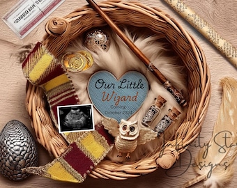 May include: A wicker basket filled with baby announcement props, including a blue heart with the text "Our Little Wizard Coming October 2024", a wand, a small owl figurine, and a sonogram image.