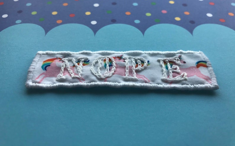 White on white ribbon with rainbow unicorns NOPE patch embroidered patch Handmade Sew on patch.
