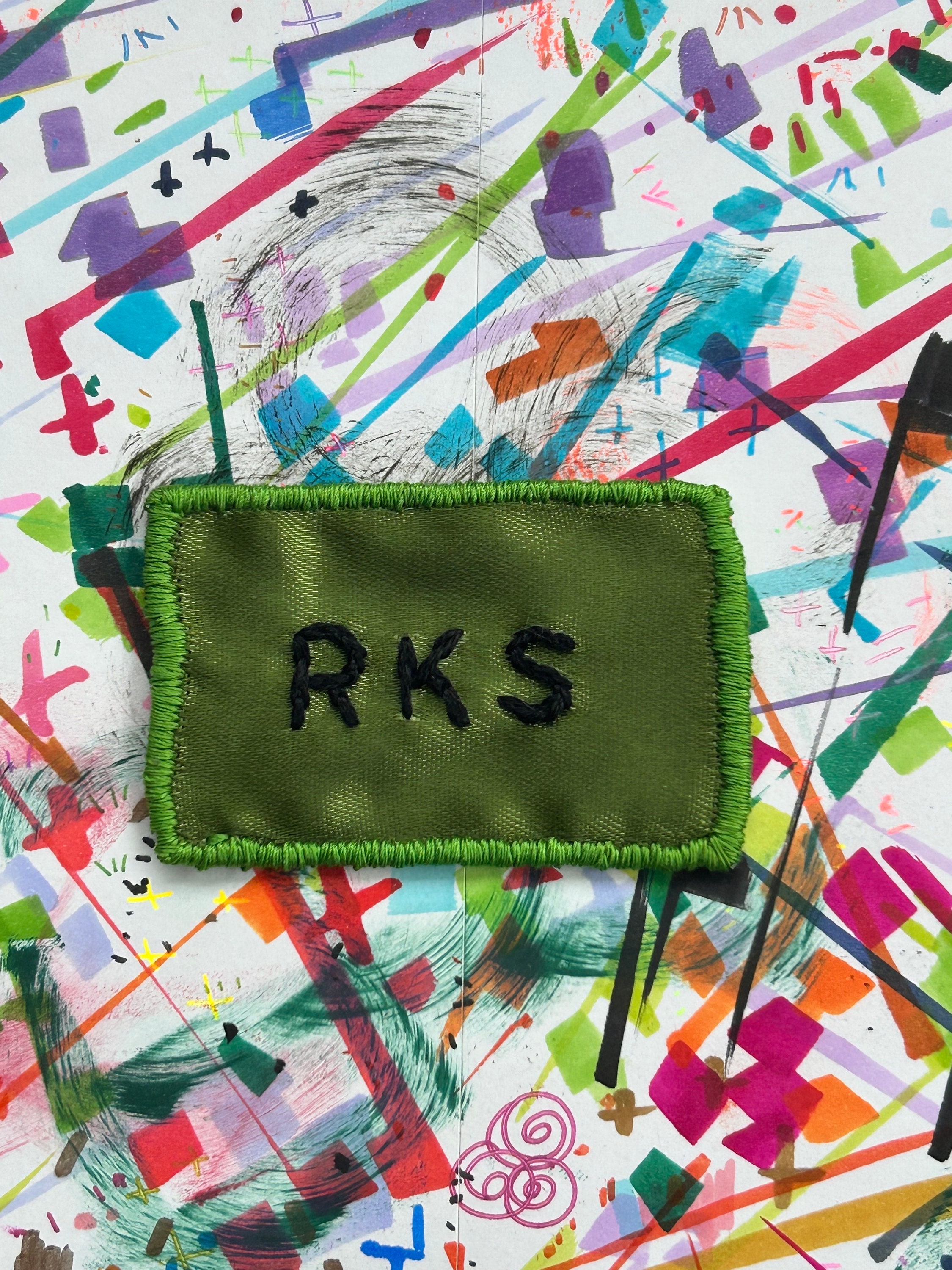 RKS band patch! // Rainbow Kitten Surprise band patch! Handmade, embroidered patch. Black on olive green ribbon. Sew on patch