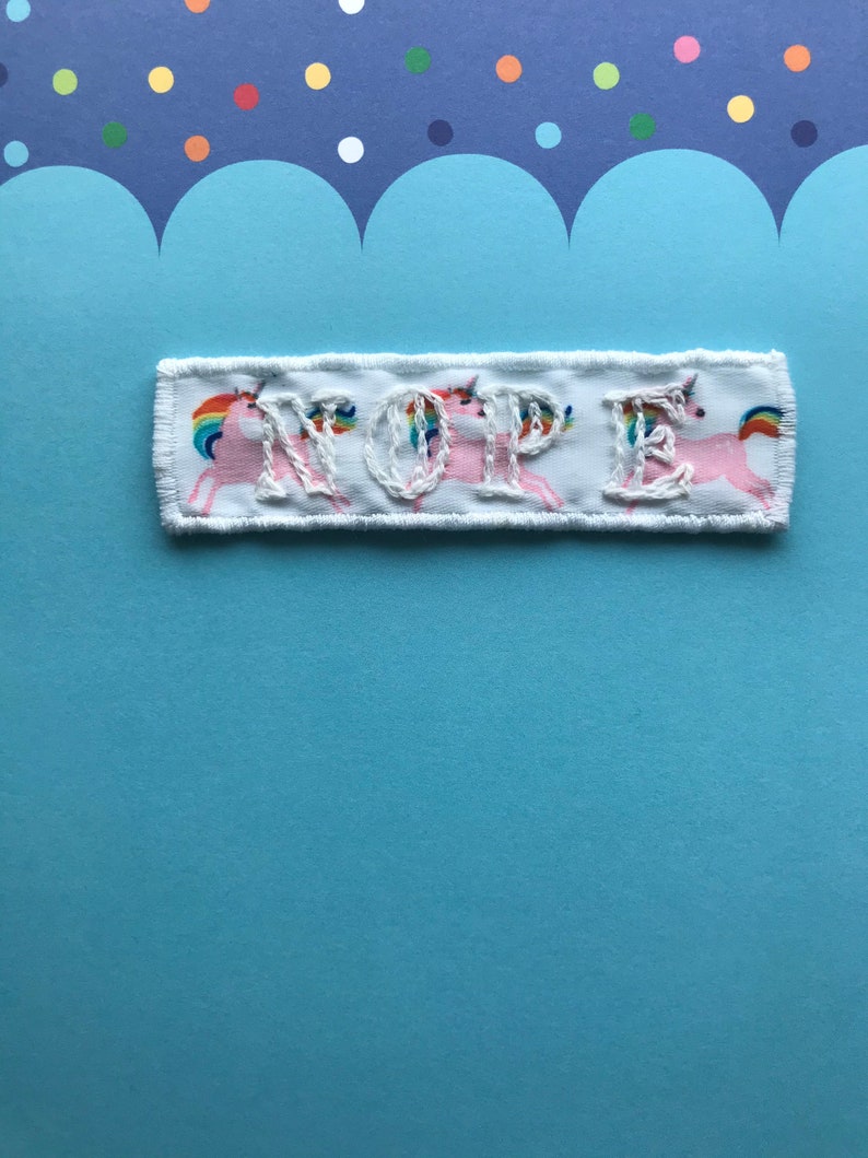 White on white ribbon with rainbow unicorns NOPE patch embroidered patch Handmade Sew on patch.