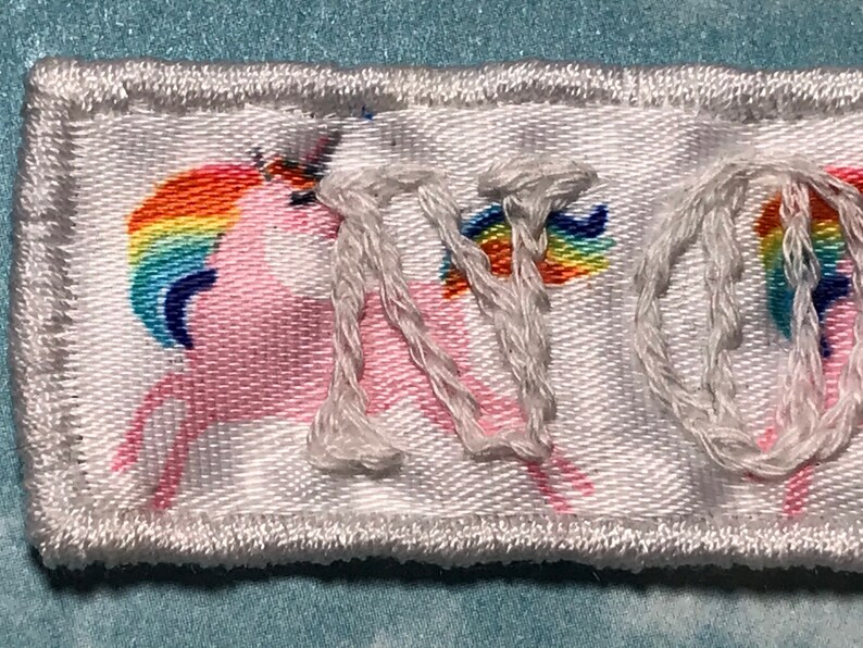 White on white ribbon with rainbow unicorns NOPE patch embroidered patch Handmade Sew on patch.