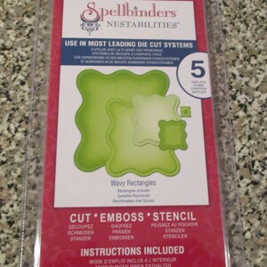 May include: A Spellbinders Nestabilities die cut set for crafting. The set includes five templates for creating wavy rectangles. The packaging is red and features the Spellbinders logo and the text "USE IN MOST LEADING DIE CUT SYSTEMS".