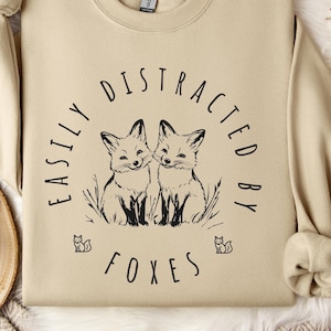Cute &#39;Easily Distracted by Foxes&#39; Sweatshirt with Foxes, Cozy Pullover for Fox Lovers, Soft Unisex Hoodie, Perfect Gift for Nature Fans