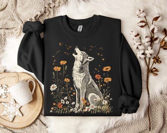 Crewneck sweatshirt with howling wolf surrounded by wildflowers, unique cottagecore design, perfect for nature lovers and wolf enthusiasts
