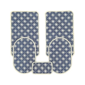 May include: Set of four blue and white patterned bath mats with a geometric design. The mats have a cream-coloured border.