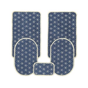 May include: A set of four blue and white floor mats with a geometric pattern. The mats are in different sizes and shapes, and they are all edged with a cream-coloured border.