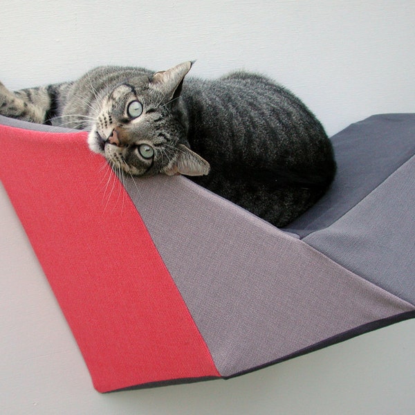 Cat shelf wall bed in coral and grey geometric