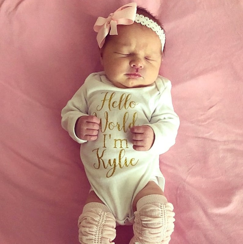 Baby Girl Coming Home Outfit Hello World Gold Glitter Personalized Baby Shower Gift Baby Bodysuit Optional Leg Warmers and Bow Headband
