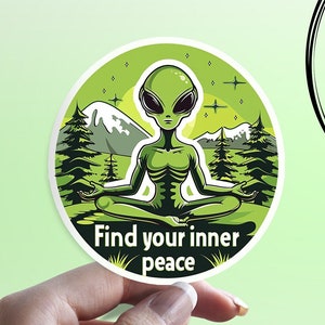 May include: A green alien meditating in a yoga pose in a green forest with mountains in the background. The text "Find your inner peace" is written below the alien.