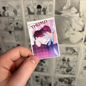 May include: A rectangular sticker featuring an illustration of two figures in a close embrace, with the word "THUMP" at the top. The figures are depicted in shades of red, purple, and blue. The word "LEAN" is at the bottom.