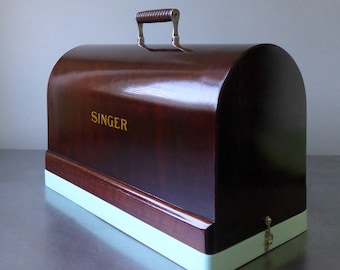 Storage box made from an upcycled "Singer" sewing machine cover.