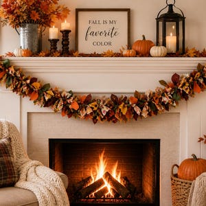 May include: A cozy fall-themed fireplace mantel decorated with pumpkins, candles, and a garland of autumn leaves. A sign reads "Fall is my favorite color." A lit fire is in the fireplace, and a plaid pillow and blanket are on a nearby chair.