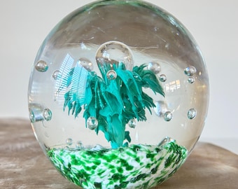 Stunning Vintage Contemporary Look Clear Glass Orb Shaped Paperweight With Controlled Bubbles & Teal Flare, Green And White Foliage.