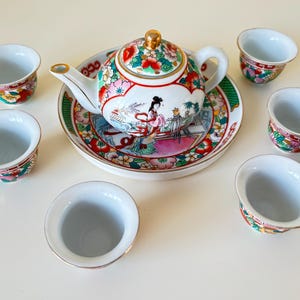 Rare Miniature Chinese Hand  Painted Famile Rose 8 Piece Tea Set, 20th Century, Teapot, Stand, 6 Small Cups.
