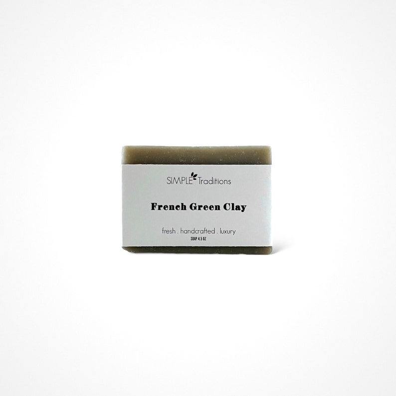 May include: A bar of green French Green Clay soap from Simple Traditions. The soap is labeled "fresh, handcrafted, luxury".