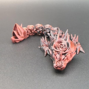 3D Printed Baby Dragon Figurine With Rose Design