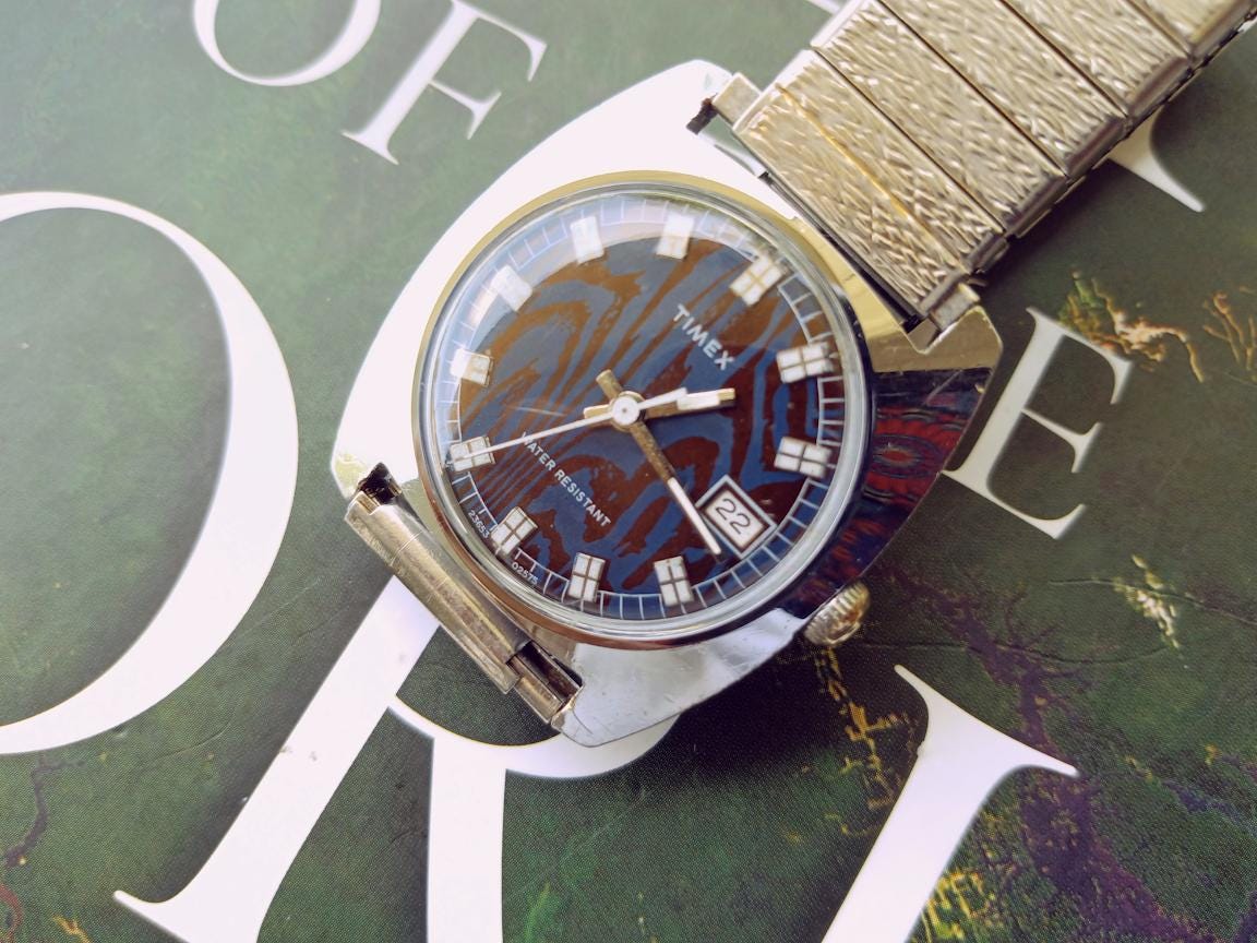 1975 Timex Sprite 23653-02575 Manual Wind Watch – Blue Moiré Dial, 31 mm Case, 16 mm Lug, Silver Stretch Bracelet | Ships FREE