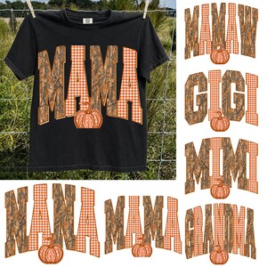 May include: A black short-sleeved t-shirt featuring the word MAMA in large block letters with a camouflage and orange gingham pattern, accented by an orange pumpkin graphic. Additional text options include MAMA, MAMAW, GIGI, MIMI, NANA, and GRANDMA.