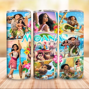 May include: A cylindrical tumbler featuring a wrap-around graphic print of characters from the movie Moana, including Moana, Maui, Pua, and Heihei. The design incorporates tropical flowers, ocean waves, and the text Moana in a blue font.