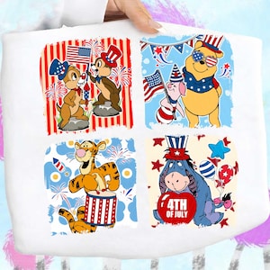 May include: White tote bag with four squares of patriotic Disney characters. Chip and Dale with a flag and firework. Winnie the Pooh and Piglet with flags. Tigger plays a drum. Eeyore holds a heart that says "4th of July".