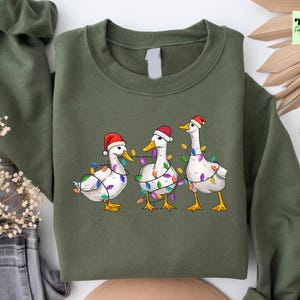 クリスマスダックスウェットシャツ、サンタダックスウェットシャツ、レディースダックスウェットシャツ、アニマルスウェットシャツ、面白いファーマーファームパーカー、クリスマススウェットシャツ