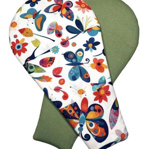 May include: Two ironing board covers, one featuring a white background with a colorful pattern of butterflies and flowers in shades of blue, red, orange, and yellow, and the other featuring a solid olive green fabric on the reverse side.