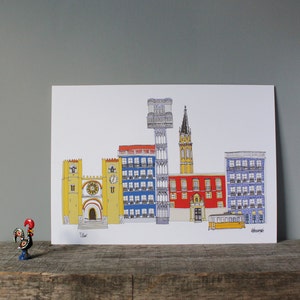 May include: A colorful illustration of Lisbon, Portugal, featuring iconic buildings like the Jer&oacute;nimos Monastery, the Bel&eacute;m Tower, and the Santa Justa Lift. The illustration is printed on white paper and framed with a white border.